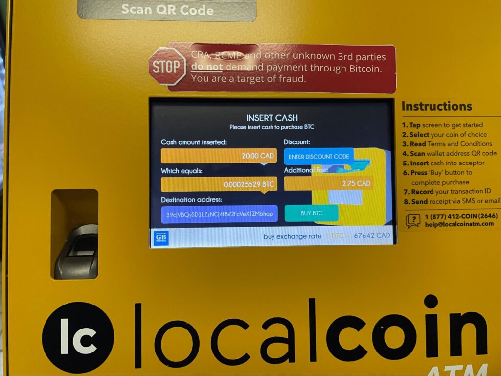 Inserting cash in Bitcoin ATM (step 6)